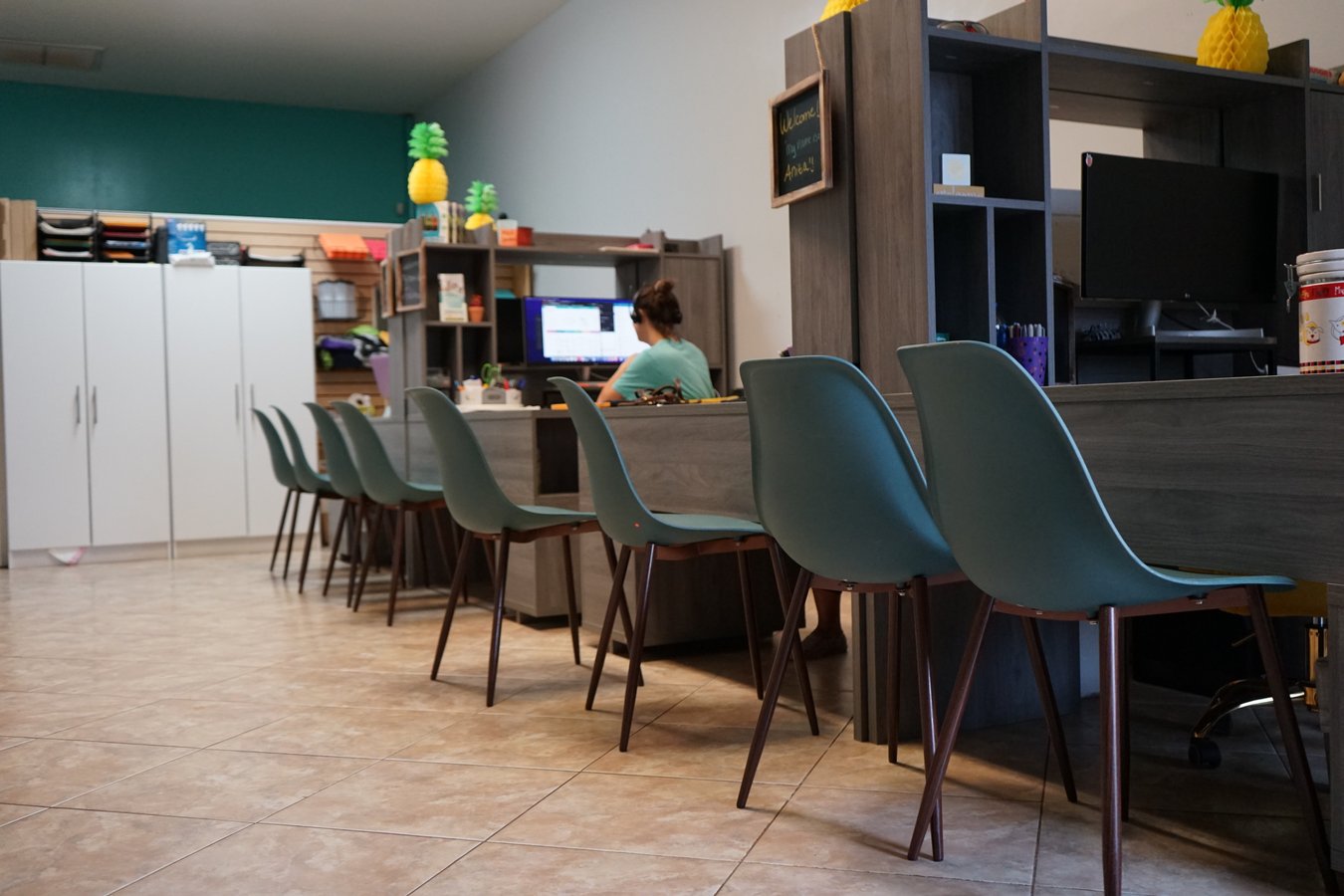 The welcoming indoor reception and waiting area where owners get started at Partners Dogs.