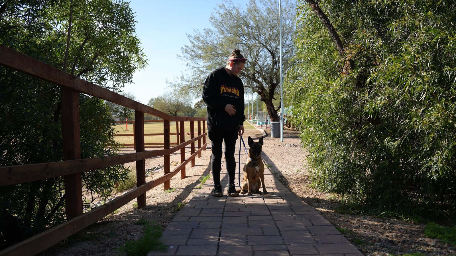 A staff member walks near the Cave Creek gate in the desert, the more direct of our two campuses for northern Peoria and Vistancia families.