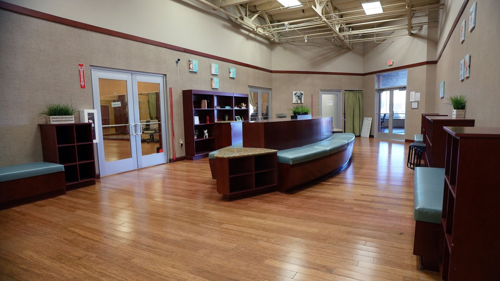 The bright reception and lobby at the Scottsdale Shea campus with a desk and glass doors, minutes from Paradise Valley.